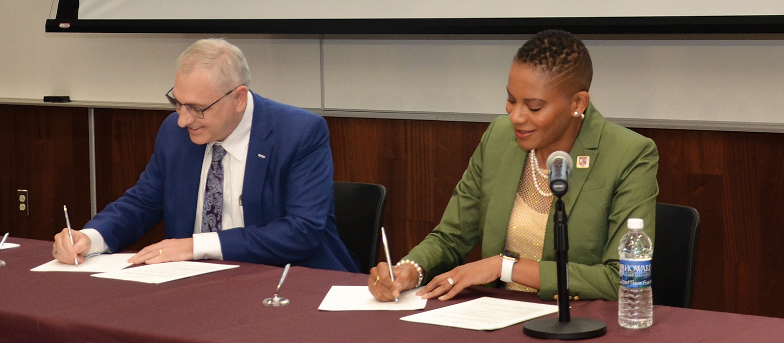 Dr. Willis and Dr. Sims signing MOU