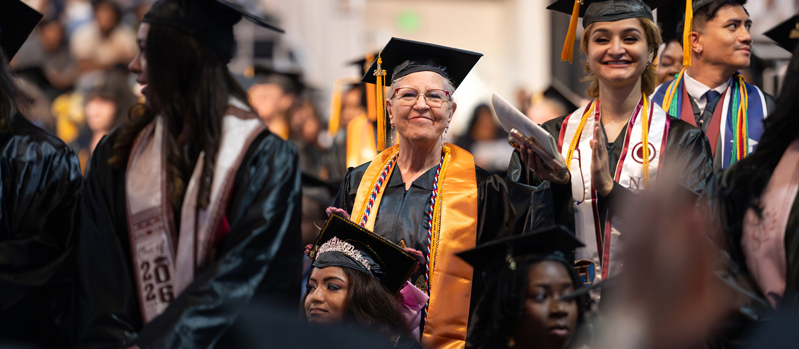 Howard Community College graduates celebrate earning their degrees during commencement, marking the beginning of their alumni journey.
